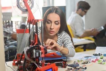 Professional female engineer working with 3d printing