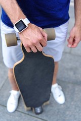 Skillful skateboarder with modern tracker