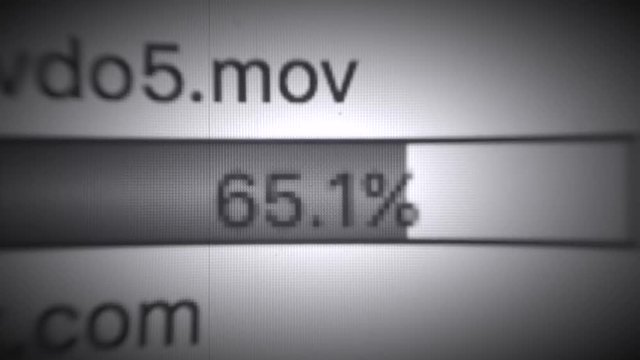 scale of loading of files on the FTP server from computer monitor, old film style