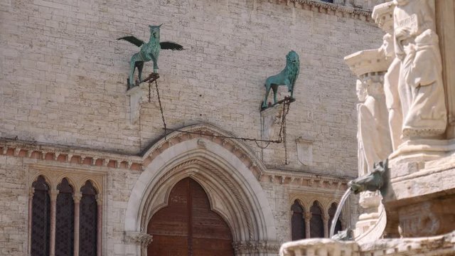 Gryffin and Lion statues on the facade of Perugia Palace, Italy
