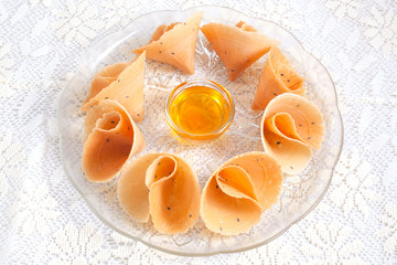 tong muan snack with honey thailand on white blackground