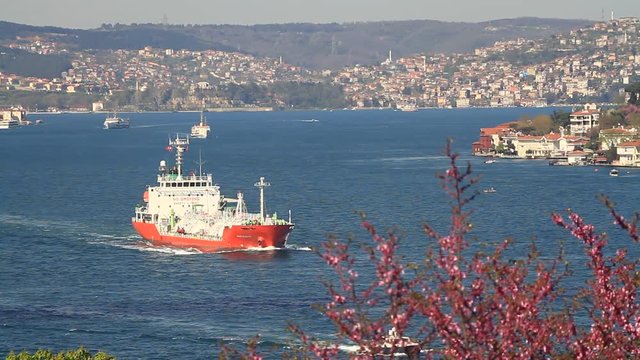 Tanker ship cruising along coast of Bosporus Sea in Istanbul, Turkey. Bosphorus in Springtime 
