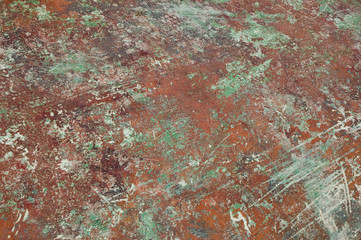 detail of red-green worn down boat painting