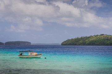 Fototapeta na wymiar boat at the white sand beaches in the kingdom of Tonga