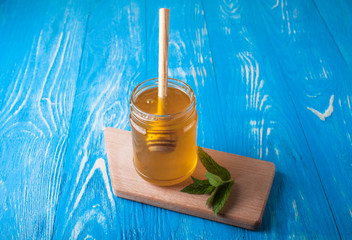 Jar of honey and spoon for honey