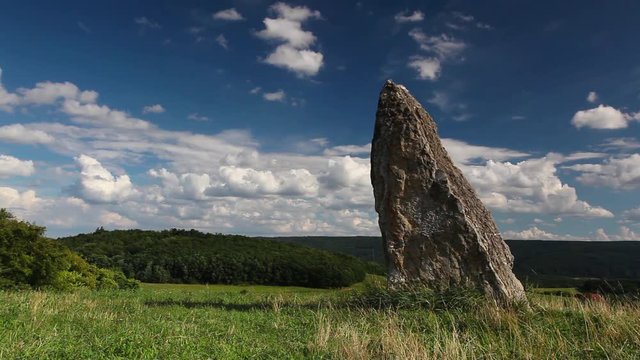 Time - lapse - Millennium menhir on the hill at sunset