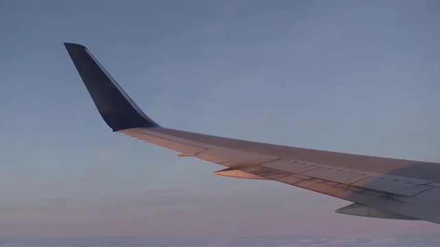 Skimming the clouds on final approach to Charles de Gaulle International airport in Paris, France