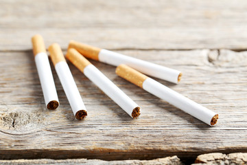 Tobacco cigarettes on a grey wooden table