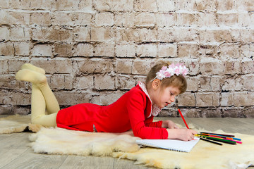 Girl draws pencil on the album. School Education, Art.