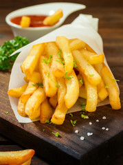 Fresh Fried French Fries With Ketchup on Wooden Table