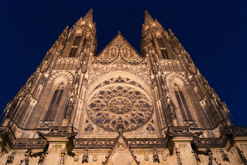 Prague Castle Cathedral Saint St Vitus front facade entry gate spire rosette by night