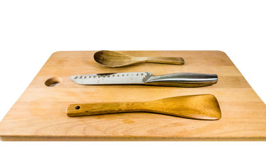 Kitchen equipment : ladle and kitchen flipper made form wood. Isolate on a white background.