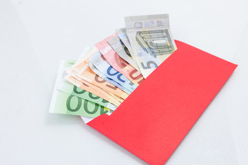 Money in a bright red envelope.