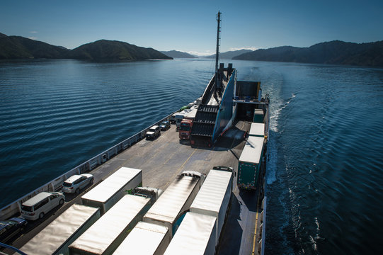 Ferry loaded with trucks and cars traveling from Wellington to Picton via Marlborough Sounds, New Zealand