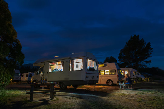 Campervans camping at Peketa Beach, Kaikoura, South Island of New Zealand, during sunset