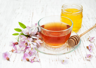 tea and honey with acacia blossoms