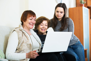 Three women with laptop