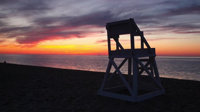 Watchtower and amazing sunset on the empty beach, Cape Cod, USA