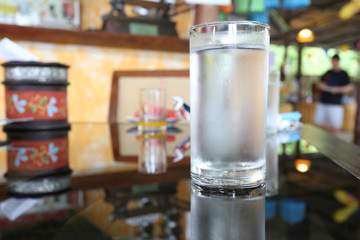 Glass of water placed on the foods table.