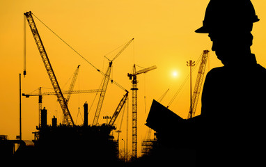 Silhouettes man of workers on a background of Construction