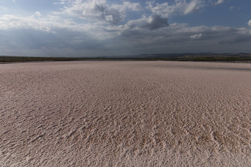 Pool of pink salt water for salt production.