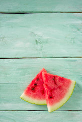 Fototapeta na wymiar freshly cut water melon on wooden table