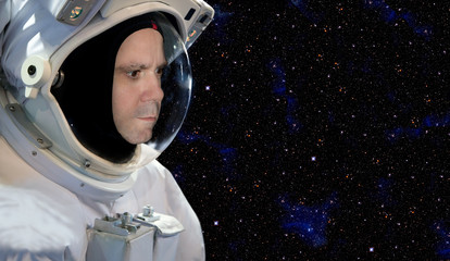 Astronaut on space mission with stars on the background © milkovasa
