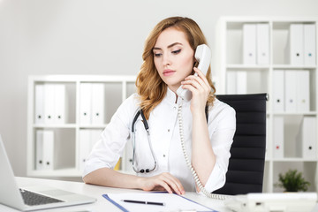 Woman doctor making call