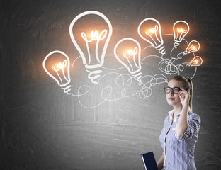 Nerd girl and chain of light bulbs