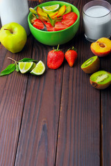 Composition of oatmeals in green plate decorated with slice of s