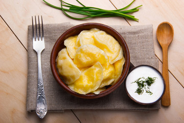 Vareniks(dumplings) - national ukrainian cuisine. wooden spoon ,