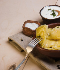 Vareniks (dumplings)  with sour cream - national ukrainian cuisi