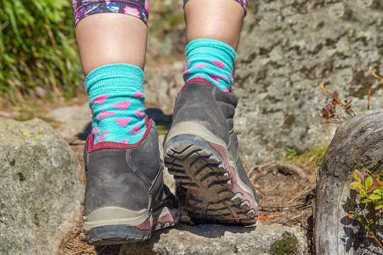 closeup of sole of woman hiking boots in mountains
