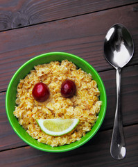 oatmeal smiling (smile) concept.Eyes merry, mouth lime.Flat lay.