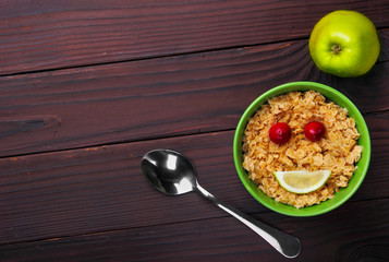 oatmeal smiling (smile) spoon and green apple.Breakfast.concept.