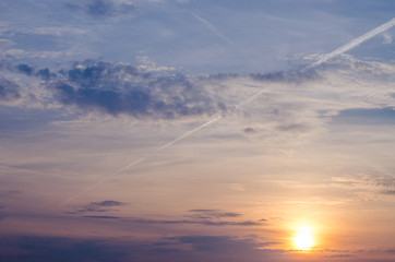 Bright orange and yellow colors sunset sky. sunset with a line by the plane.