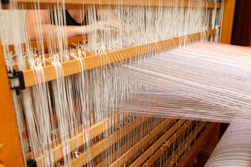 Woman's hands on the color warp