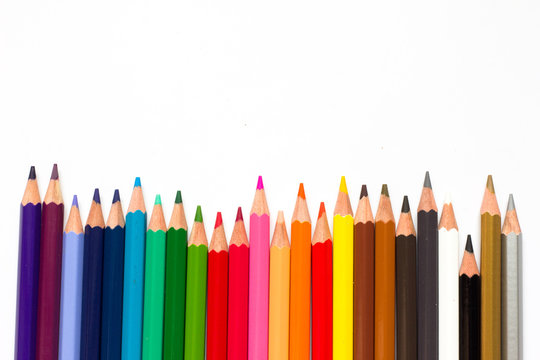 Row of color pencil on white background