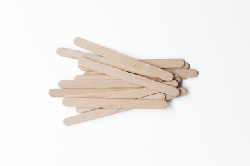 Wooden ice-cream sticks on white background..