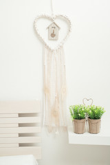 Dream catcher with beige feathers