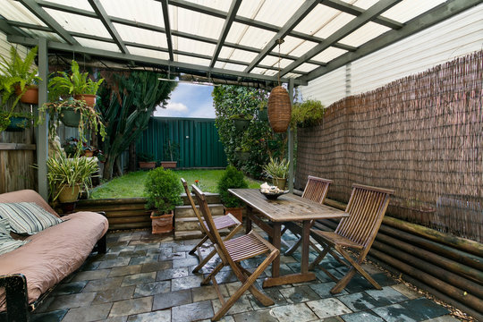 back yard with outdoor seating and barbecue with family