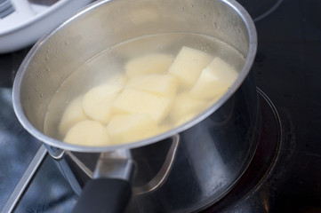 Fototapeta na wymiar Potatoes boiling in a pot