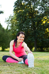 Fototapeta premium young woman exercising in the park