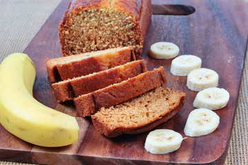 Homemade banana cake with sliced banana on butcher served.Selective focus