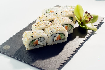 Sushi salmon roll with black and white sesame