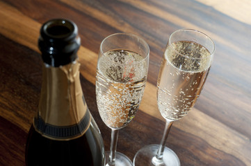 Two flutes of chilled champagne