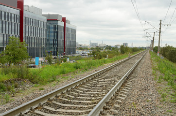 Fototapeta premium The railroad through the town.