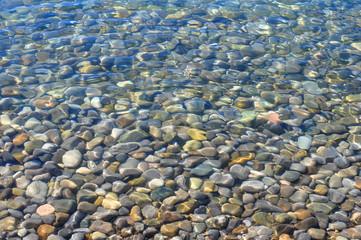 Natural Background, Stones Texture under a Transparent Sea Water