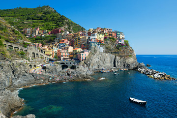Manarola town, traditional fishing village houses on a rock over the sea, Cinque Terre, Italy