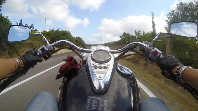 a classic motorcycle in first person view